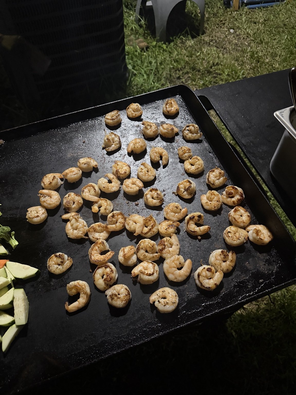 Golden shrimp seared on the outdoor hibachi grill